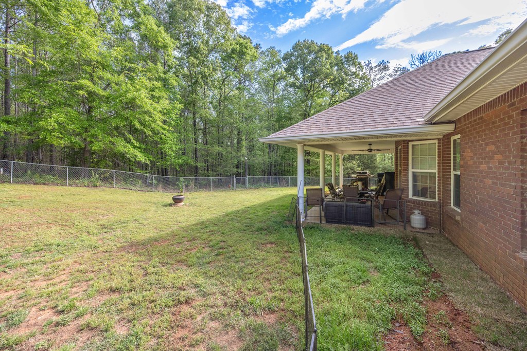 2083 Johnson Mill Road Hamilton, GA 31811 - Photo 34 of 54 a view of a chair and tables in the patio