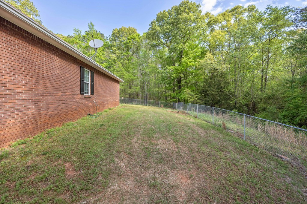 2083 Johnson Mill Road Hamilton, GA 31811 - Photo 35 of 54 a backyard of a house with lots of green space