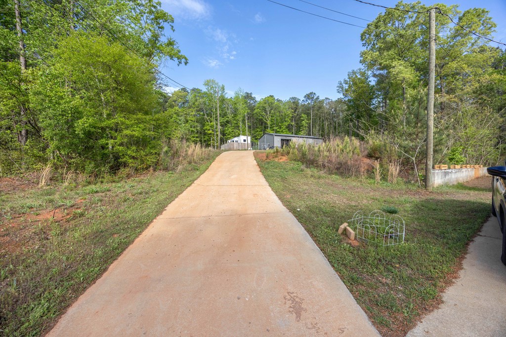 2083 Johnson Mill Road Hamilton, GA 31811 - Photo 36 of 54 a view of flowing water with large building in front of it