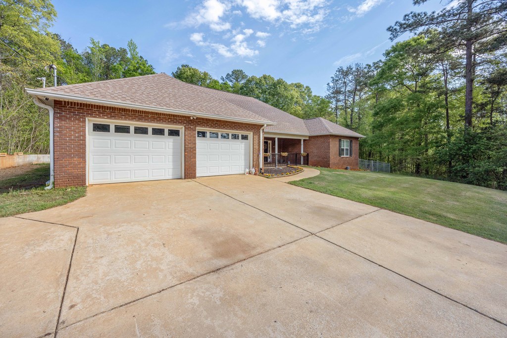2083 Johnson Mill Road Hamilton, GA 31811 - Photo 45 of 54 a front view of a house with yard and trees