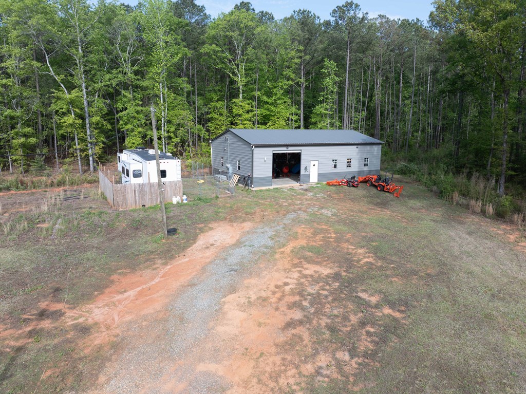 2083 Johnson Mill Road Hamilton, GA 31811 - Photo 54 of 54 a view of a house with a backyard and trees