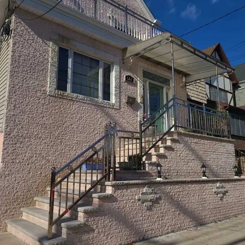 a view of house with wooden deck