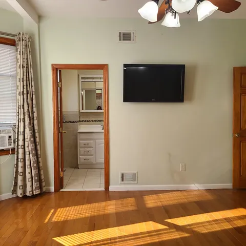 a view of a livingroom with wooden floor