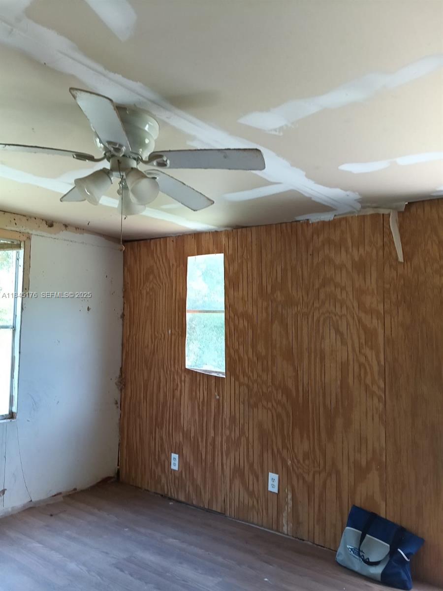 147 2nd Way Interlachen, FL 32148 - Photo 12 of 28 wooden floor in an empty room
