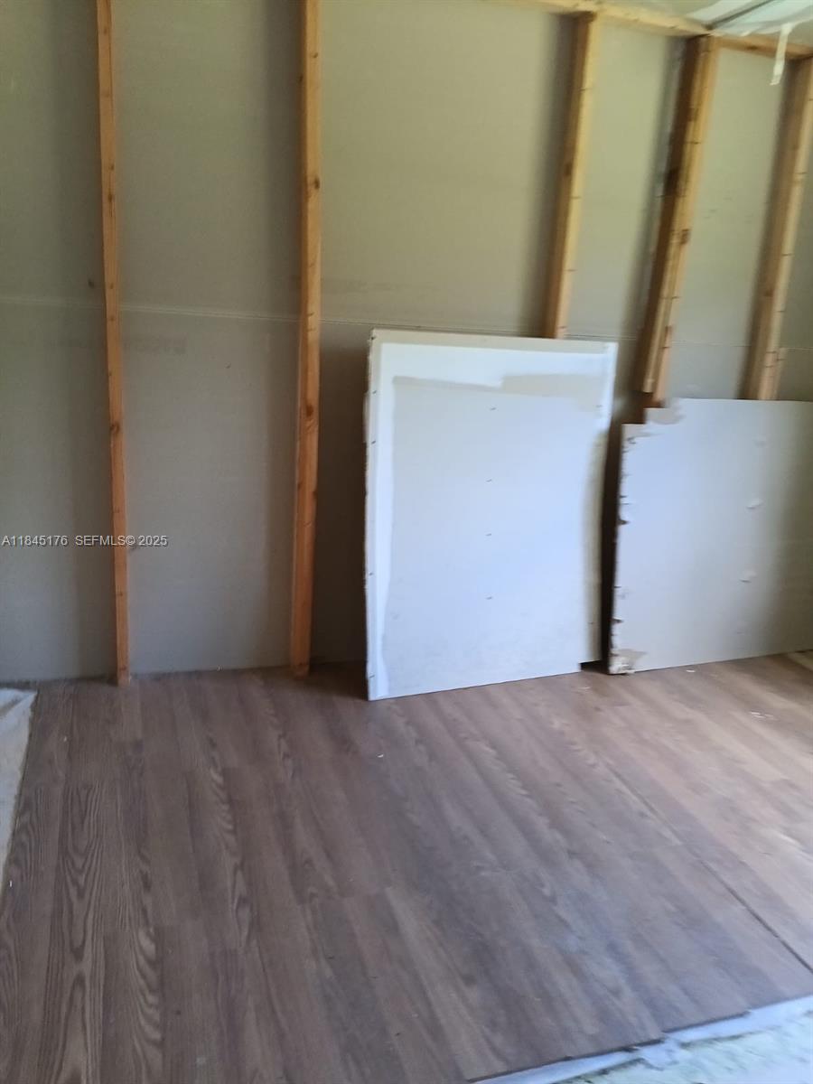 147 2nd Way Interlachen, FL 32148 - Photo 19 of 28 a view of an empty room with wooden floor