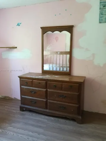 a view of brick house with a yard