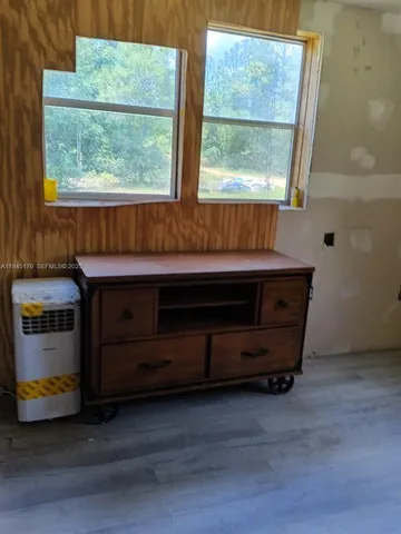 a room with a bed and a window