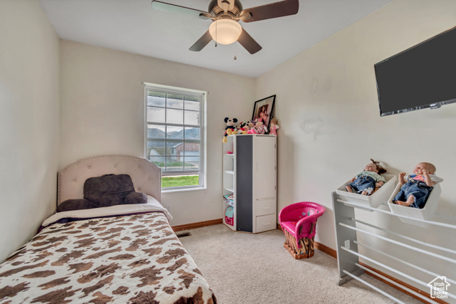 1225 North 1380th Street West Mapleton, UT 84664 - Photo 8 of 18 Bedroom with light colored carpet and a ceiling fan