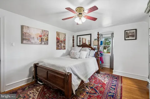 a bed room with a bed and a chandelier