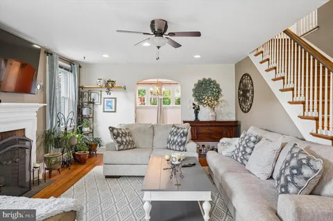 a living room with furniture fireplace and a flat screen tv