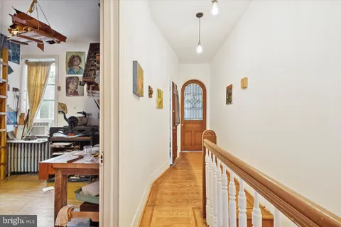 a view of a workspace with furniture and a kitchen