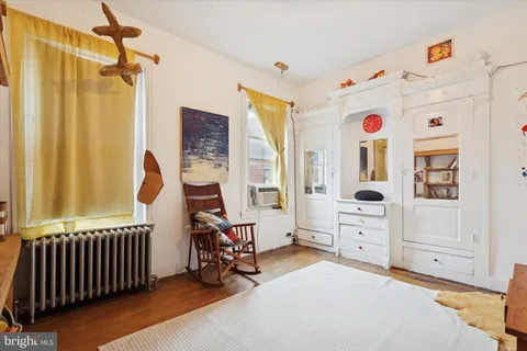 a bathroom with a toilet and a bathtub