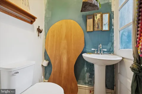 a view of a livingroom with furniture and a workspace