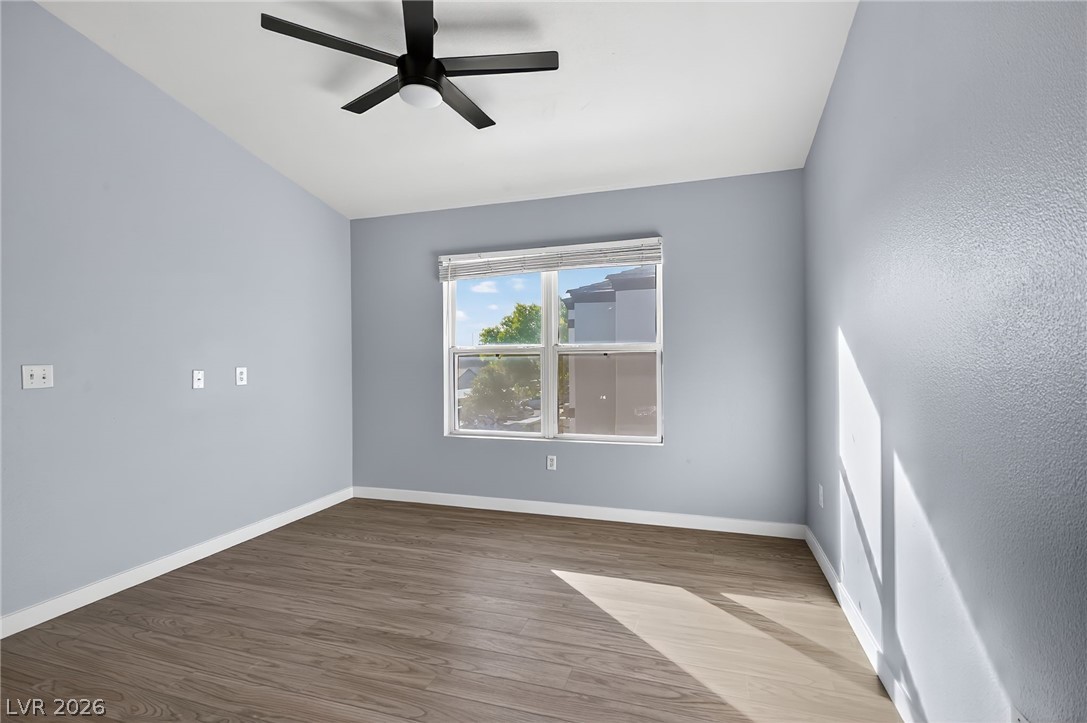 7255 West Sunset Road, Unit 2144 Las Vegas, NV 89113 - Photo 6 of 23 Spare room featuring wood finished floors and a ceiling fan
