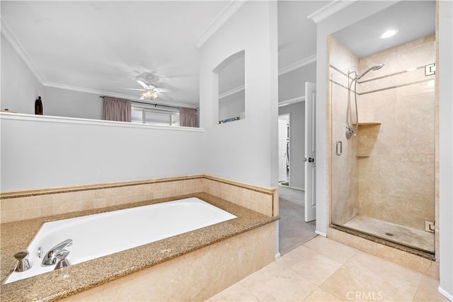 a bathroom with a tub and a shower