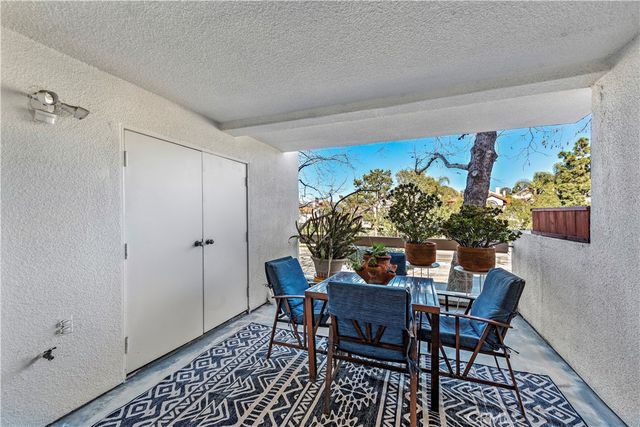 a view of a dining room with furniture and window