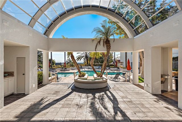 a view of a dining room with a table and chairs