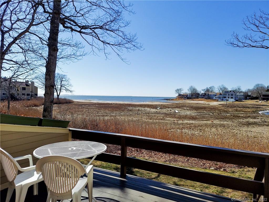 138 Sandy Point Road Old Saybrook, CT 06475 - Photo 1 of 1 a view of a chairs and table on the terrace