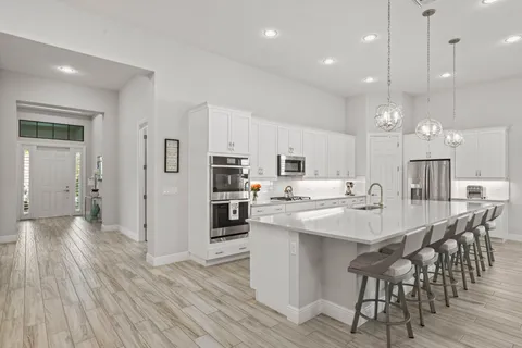 a kitchen with a sink and cabinets