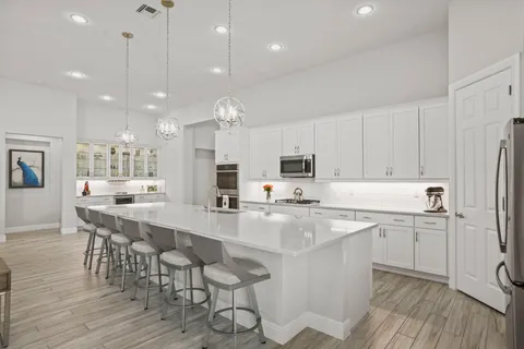 a view of a kitchen with a sink and dish washer