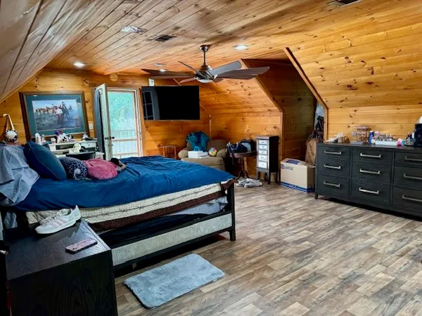 a view of a house with backyard porch and sitting area