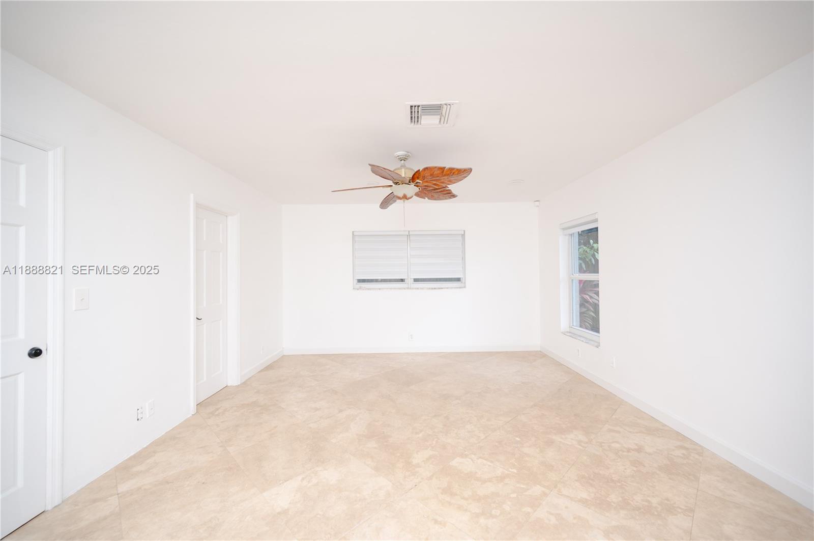 9881 Southwest 1st Court Plantation, FL 33324 - Photo 11 of 52 an empty room with a window