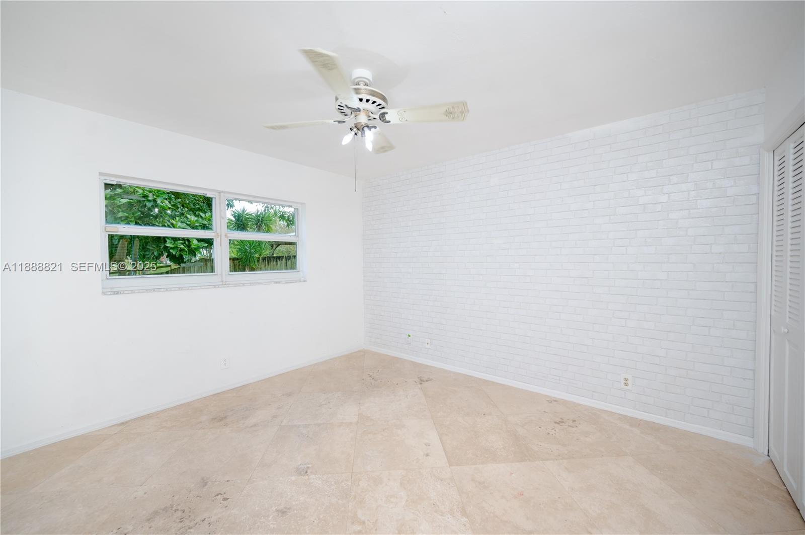 9881 Southwest 1st Court Plantation, FL 33324 - Photo 17 of 52 an empty room with a window