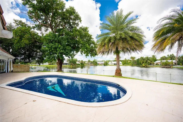 a view of swimming pool having outdoor seating