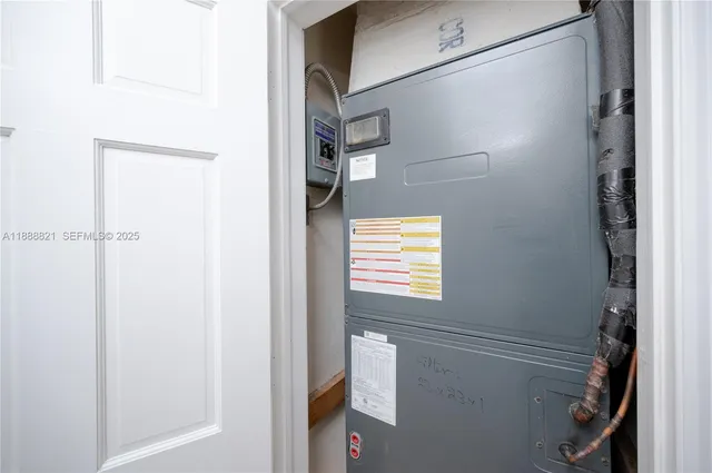 an empty room with a window and a ceiling fan