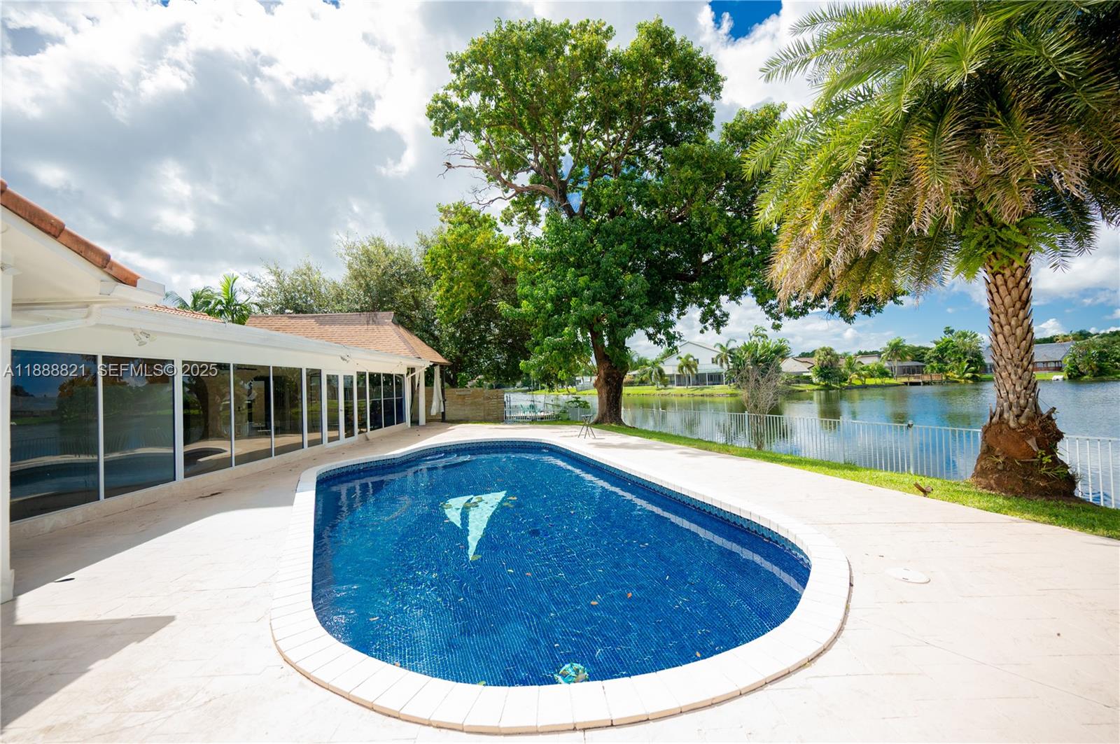 9881 Southwest 1st Court Plantation, FL 33324 - Photo 3 of 52 a view of a house with swimming pool and a yard