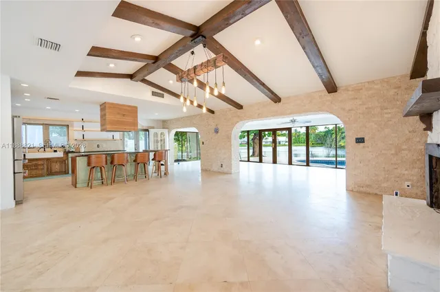 a front view of a house with garden and yard