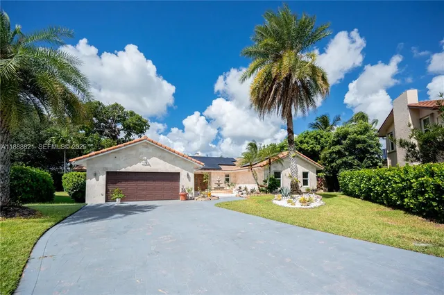 an aerial view of residential house with outdoor space and lake view