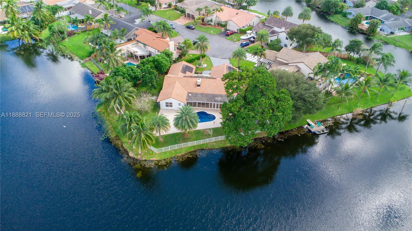 9881 Southwest 1st Court Plantation, FL 33324 - Photo 4 of 52 an aerial view of a house with garden space and lake view