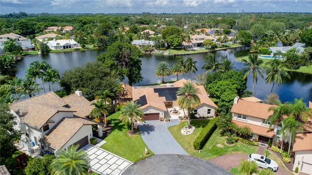 an aerial view of a house swimming pool and outdoor space