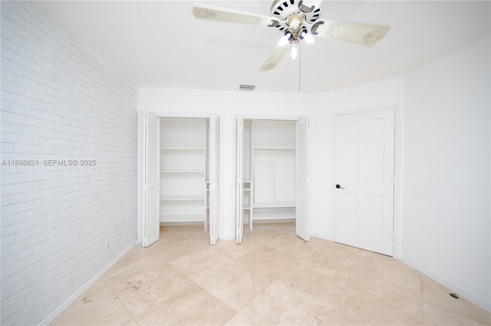 9881 Southwest 1st Court Plantation, FL 33324 - Photo 5 of 52 a view of a chandelier fan and entryway