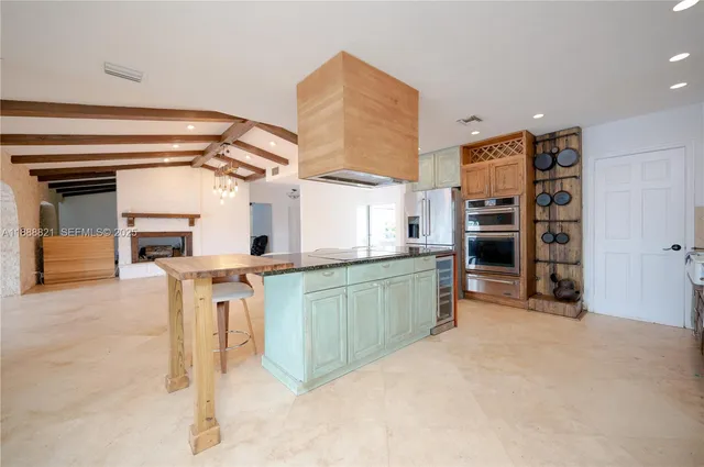 a view of kitchen with furniture and window