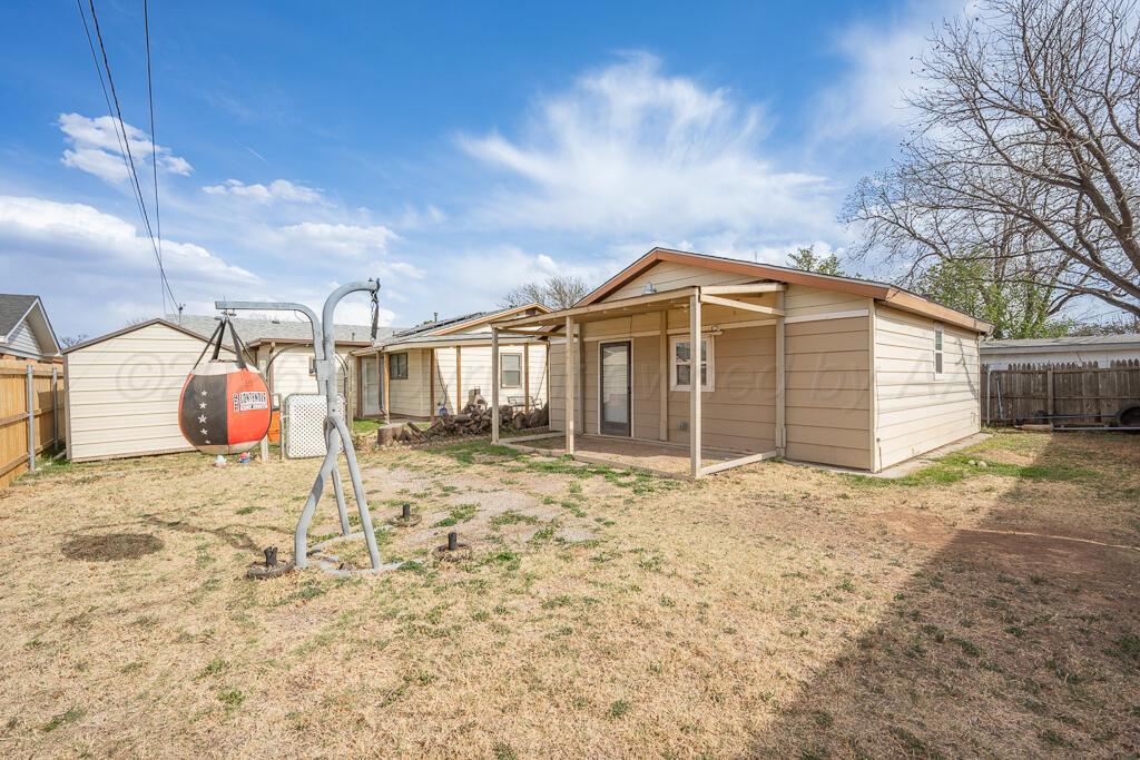 2910 Browning Street Amarillo, TX 79103 - Photo 22 of 28 a front view of a house with a yard
