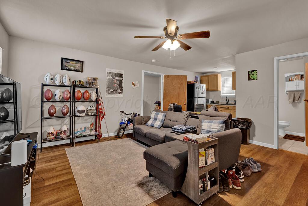 2910 Browning Street Amarillo, TX 79103 - Photo 25 of 28 a living room with furniture and wooden floor