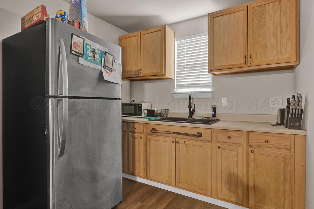 2910 Browning Street Amarillo, TX 79103 - Photo 27 of 28 a white refrigerator freezer sitting in a kitchen
