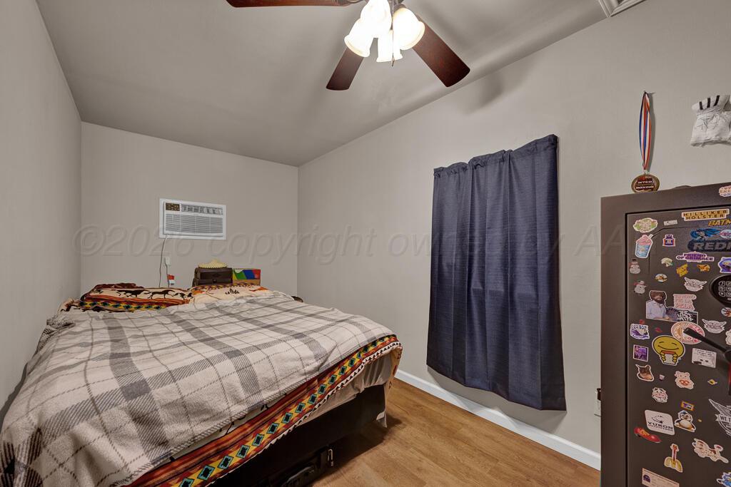 2910 Browning Street Amarillo, TX 79103 - Photo 28 of 28 a bedroom with bed and wooden floor