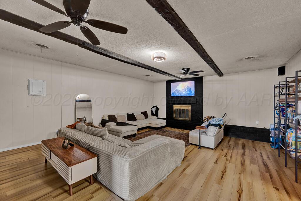 2910 Browning Street Amarillo, TX 79103 - Photo 10 of 28 a living room with furniture and a wooden floor