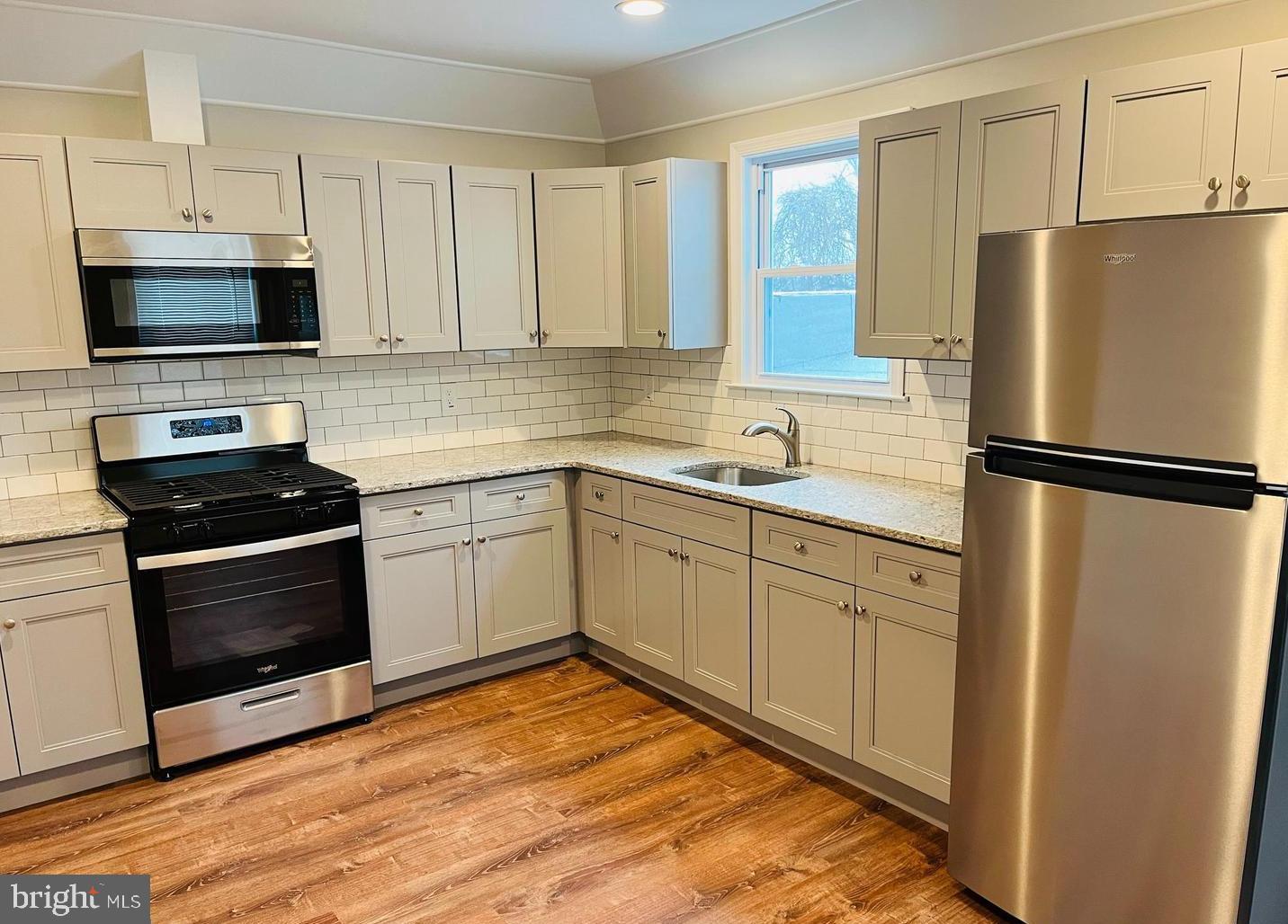 424 North Springfield Road Clifton Heights, PA 19018 - Photo 1 of 24 a kitchen with a refrigerator stove and microwave