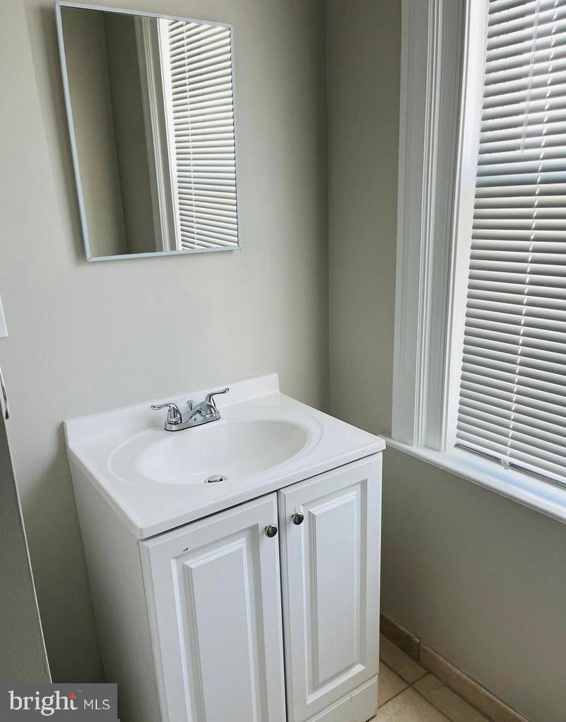 424 North Springfield Road Clifton Heights, PA 19018 - Photo 14 of 24 a bathroom with a sink and a mirror