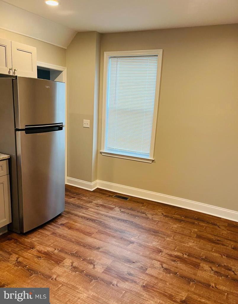 424 North Springfield Road Clifton Heights, PA 19018 - Photo 5 of 24 a view of a room with wooden floor and a refrigerator