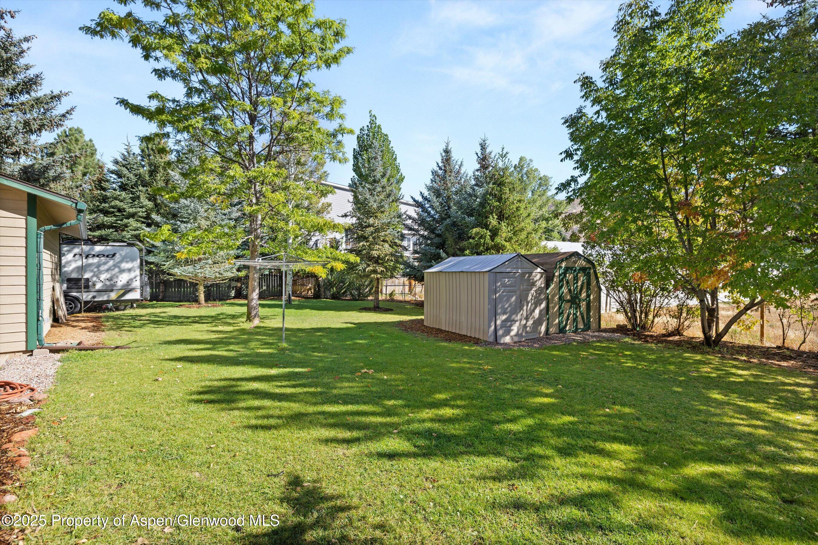 128 Hopi Carbondale, CO 81623 - Photo 39 of 43 Side lawn and outdoor sheds