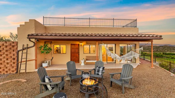 a view of a chairs and table in the terrace