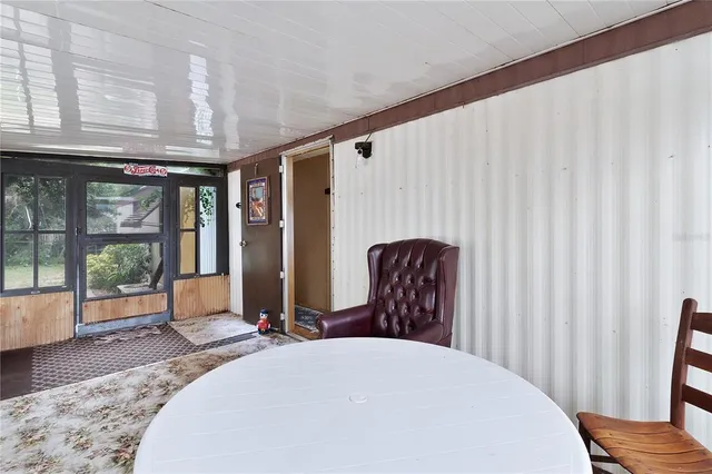 a view of a porch with wooden floor