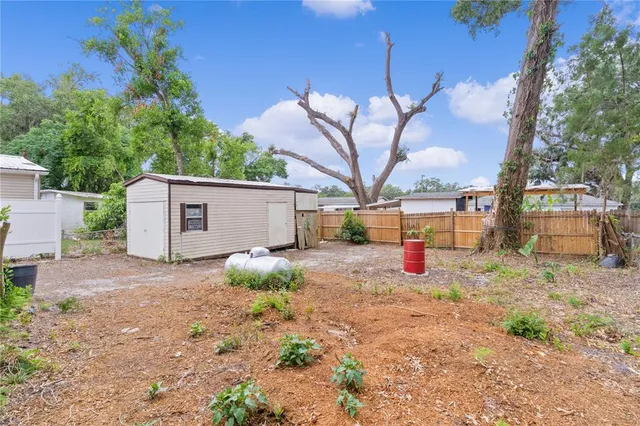 a backyard of a house with portable swimming pool and outdoor seating