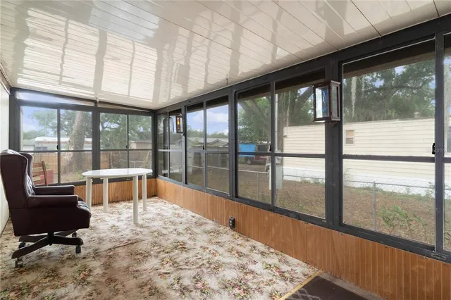 a living room with large windows