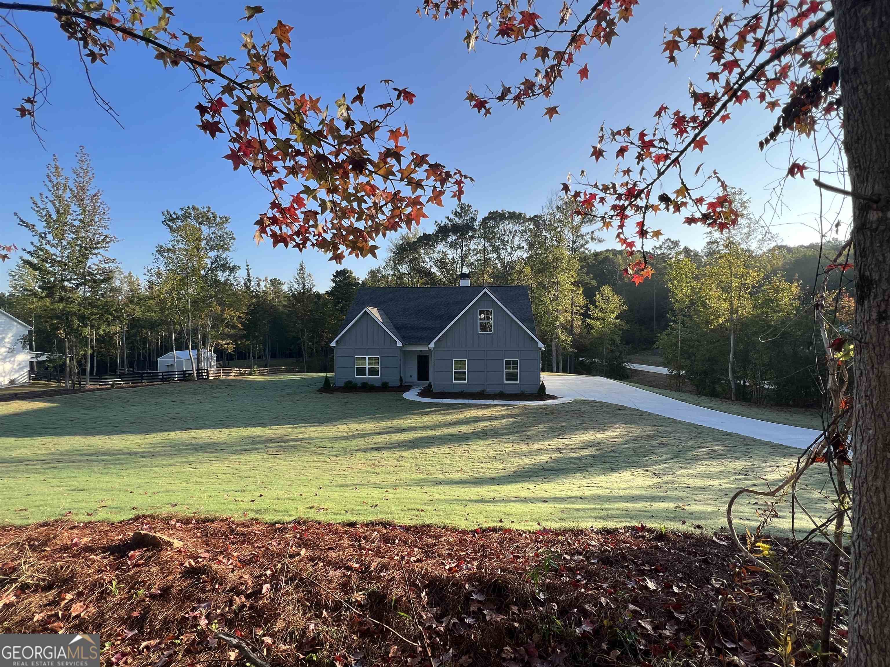 271 Walt Carmichael Road, Unit 6 Newnan, GA 30263 - Photo 1 of 1 a view of a house with a yard
